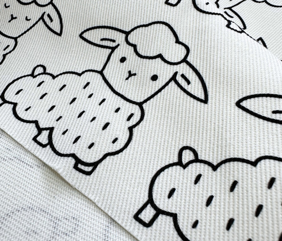 white denim fabric printed with black sheep