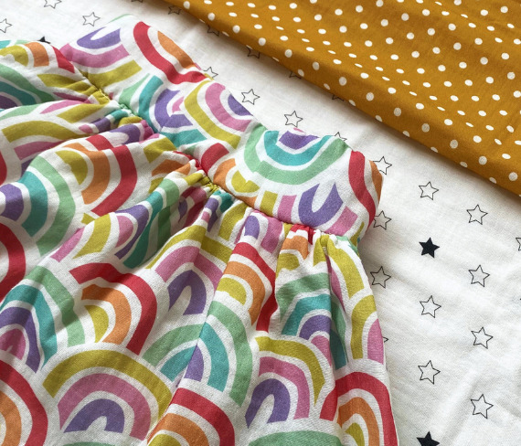 kids skirt made from muslin fabric, printed with rainbows